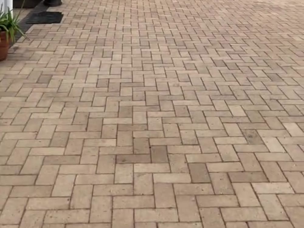 Herringbone paver patio in cream and tan tones